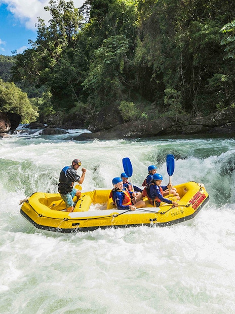 Guided rafting group navigating rapids on Barron River.