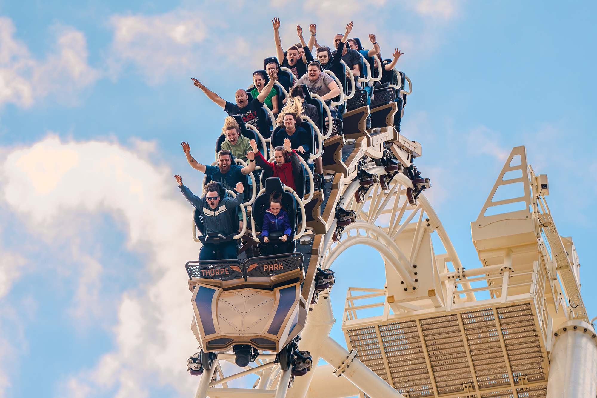 Riders experiencing a thrilling drop on THE SWARM roller coaster at Thorpe Park Resort, Surrey, UK.