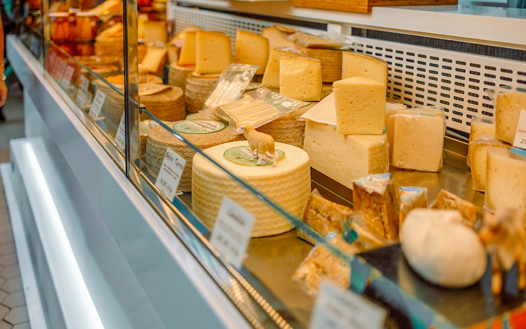 Cheese selection at a shop in D’Aligre Market, Paris.