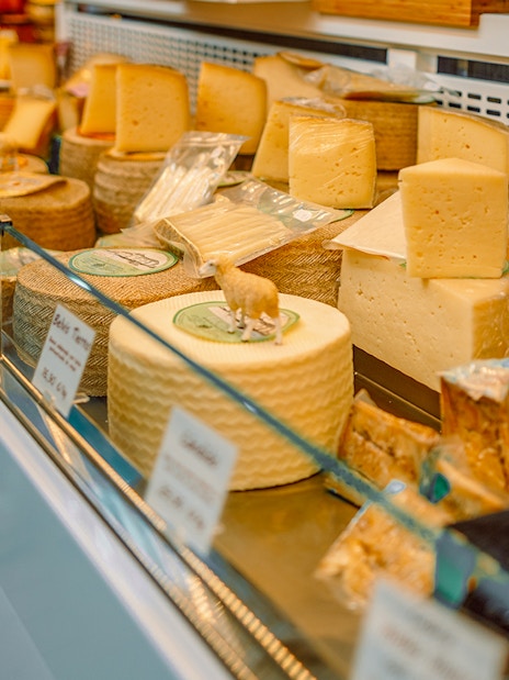 Cheese selection at a shop in D’Aligre Market, Paris.