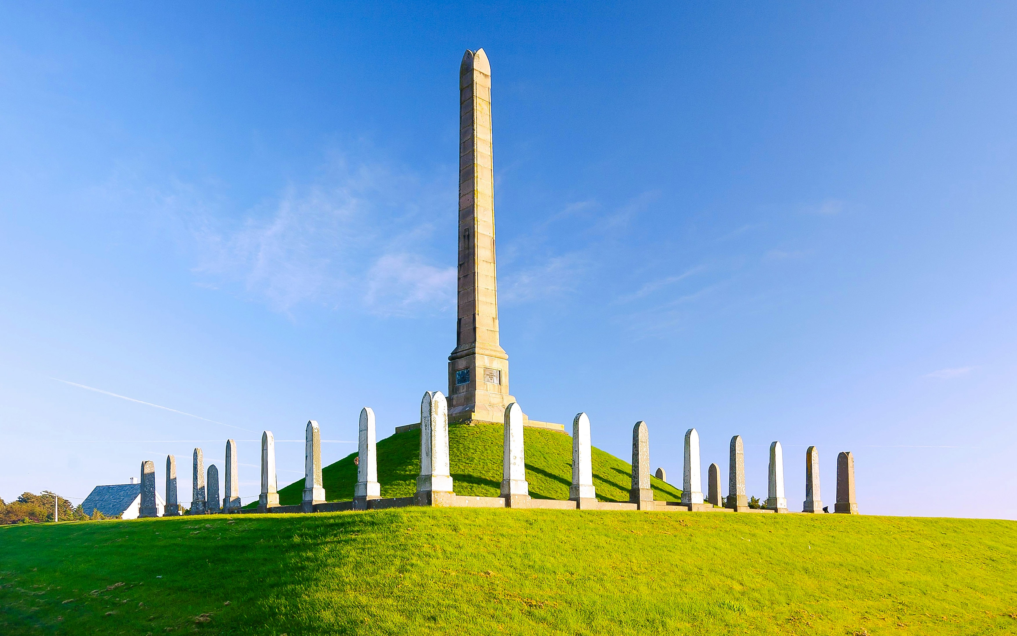 Haraldshaugen Monument obelisk surrounded by stones on a grassy hill in Haugesund.