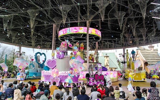 Sanrio Harmonyland parade with colorful floats and characters, Japan.