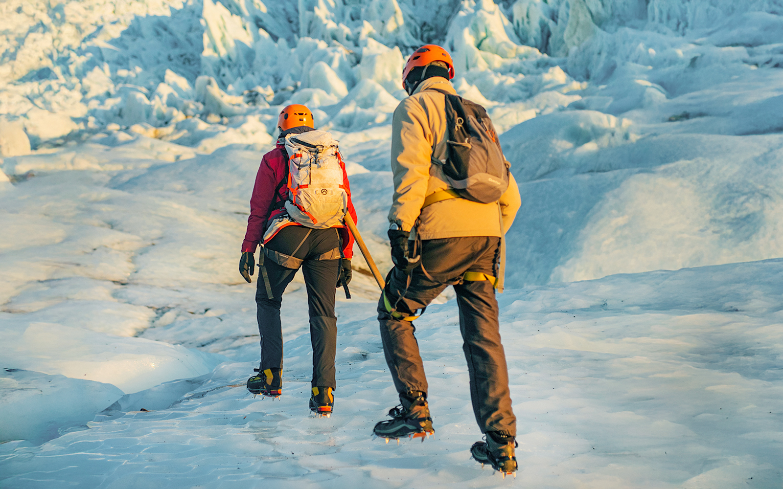 Guests hiking on Vatnajökull Glacier in Iceland with ice climbing gear.