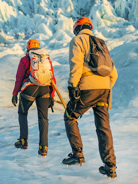 Guests hiking on Vatnajökull Glacier in Iceland with ice climbing gear.