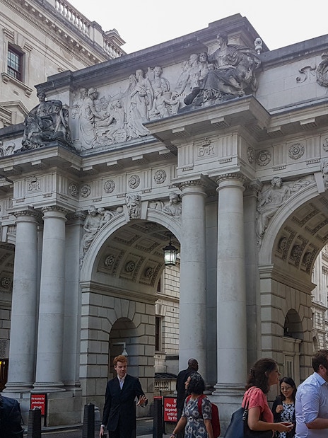 Westminster building entrance with ornate archway, part of the walking tour to Churchill's War Rooms.