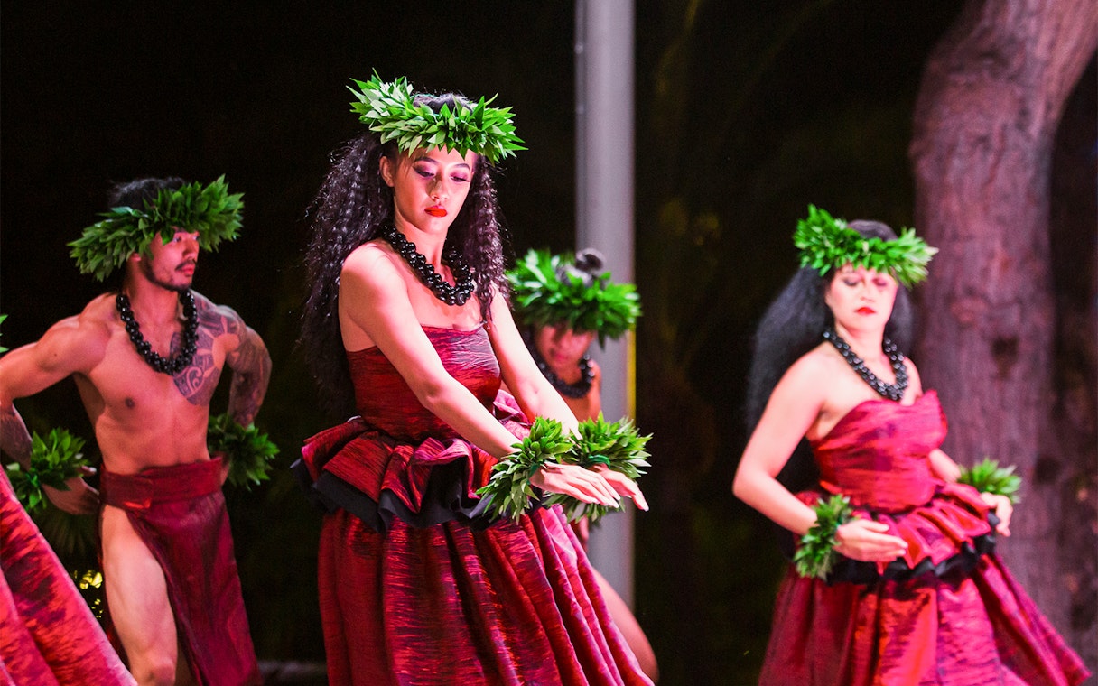 Performers in traditional attire at Moana Luau, Hawaii.