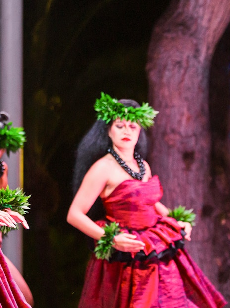 Performers in traditional attire at Moana Luau, Hawaii.