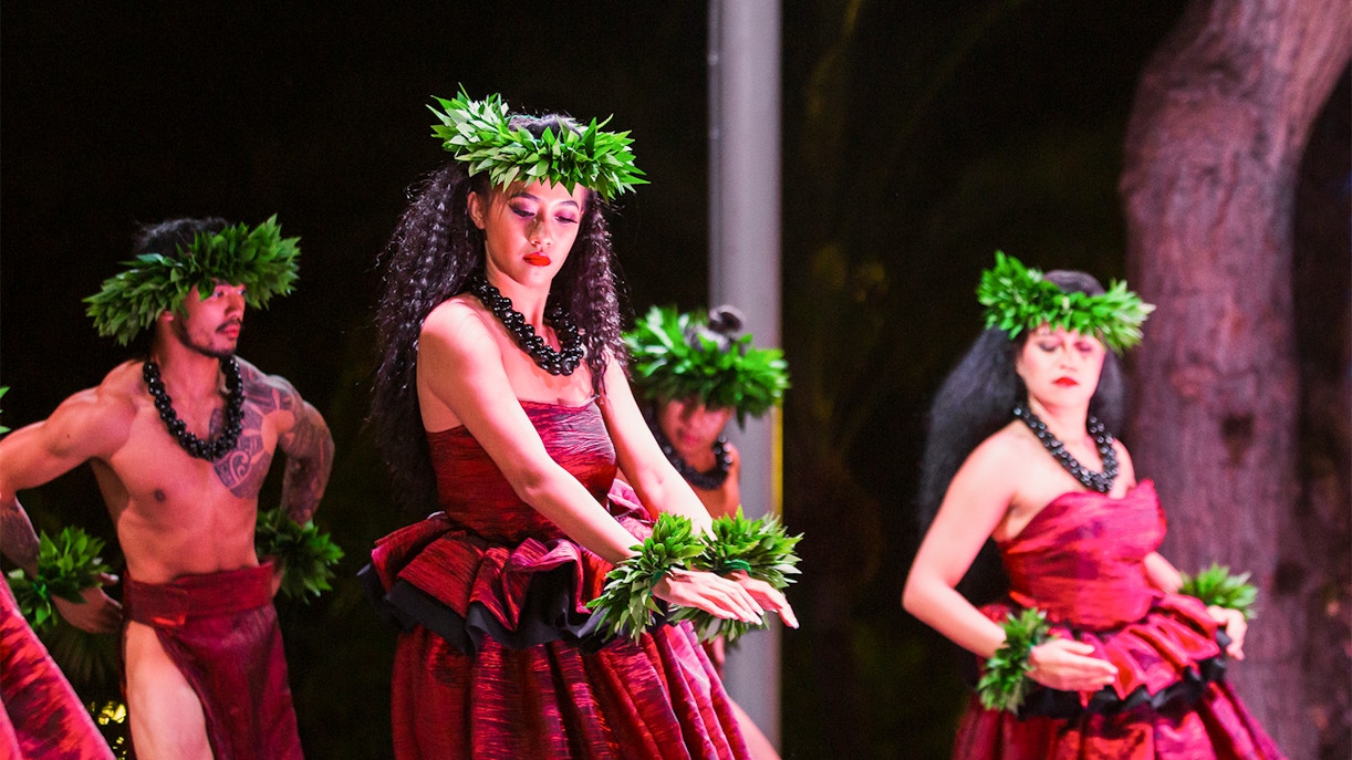 Performers in traditional attire at Moana Luau, Hawaii.