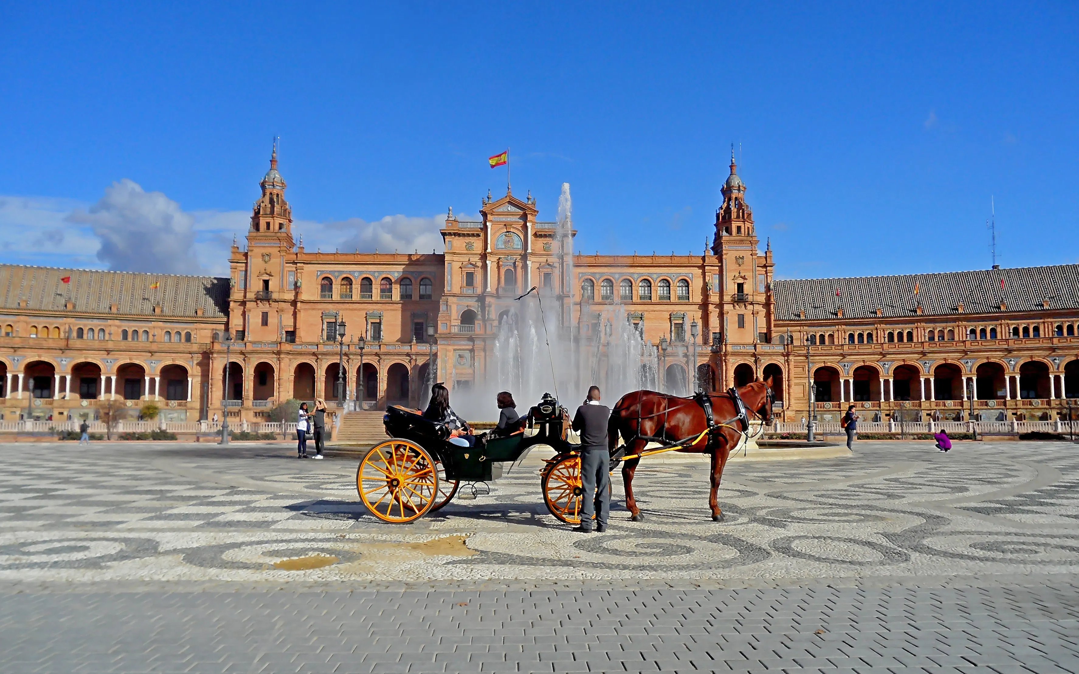 Horse carriage in front of Plaza de España, Seville, Spain.