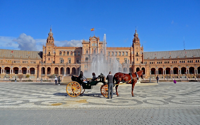 Horse carriage in front of Plaza de España, Seville, Spain.