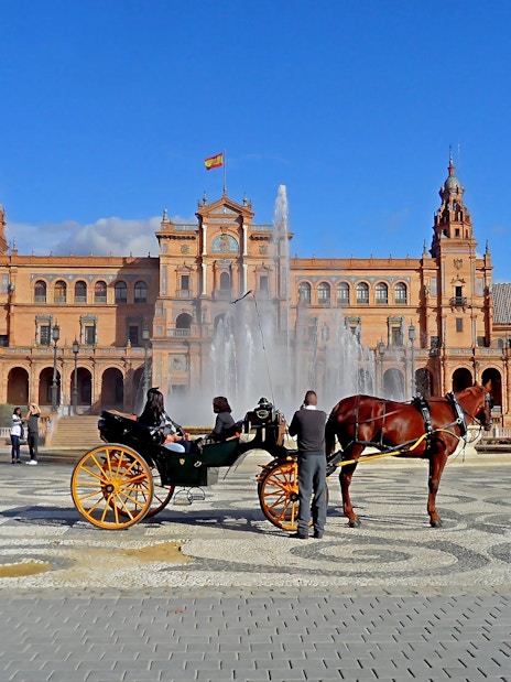 Horse carriage in front of Plaza de España, Seville, Spain.