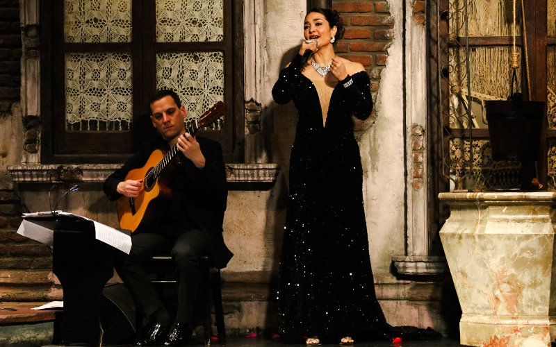 Tango singer and guitarist performing at Aljibe Tango Show in Buenos Aires.