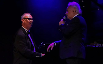 Singer performing with pianist at Michelangelo Tango Show in Buenos Aires.