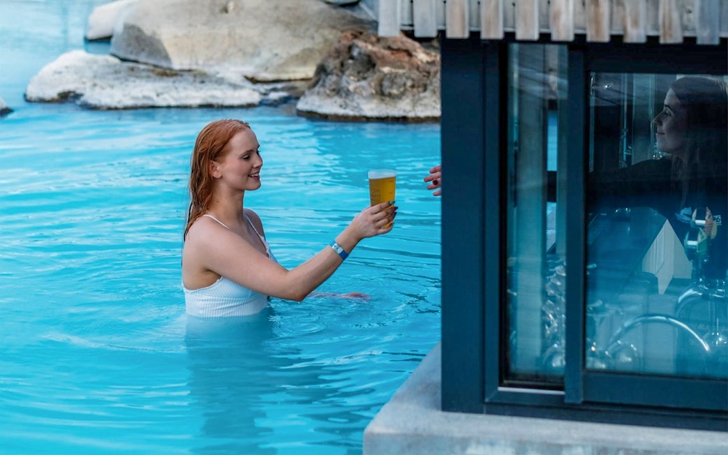Guests enjoying drinks at Myvatn Nature Baths in Iceland.