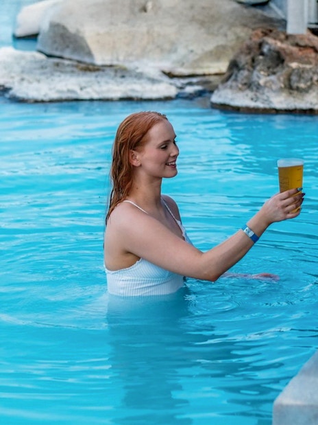 Guests enjoying drinks at Myvatn Nature Baths in Iceland.
