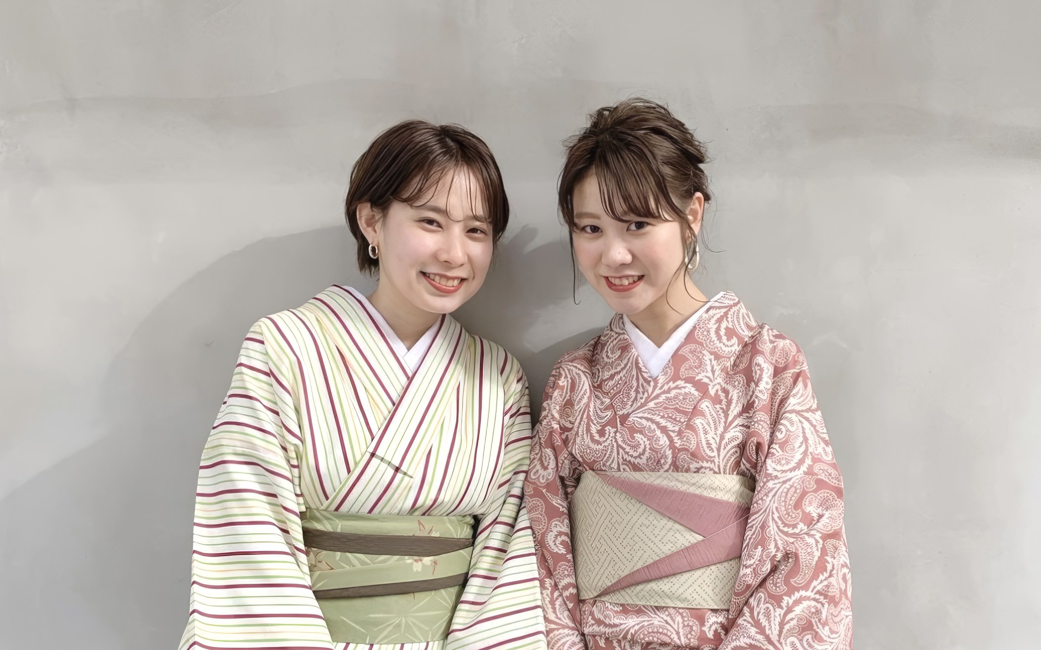 Individuals wearing traditional Japanese kimono clothing.