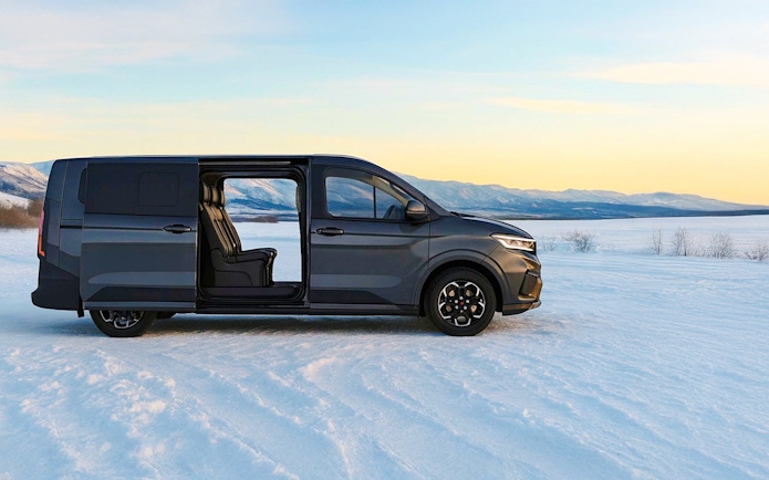 Minivan on snowy landscape, Levi transfer service.