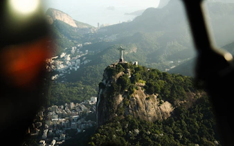 Aerial view of Christ the Redeemer statue on Corcovado Mountain during Rio de Janeiro helicopter tour.
