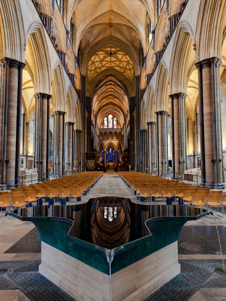 Salisbury Cathedral interior with vaulted ceilings and central nave.