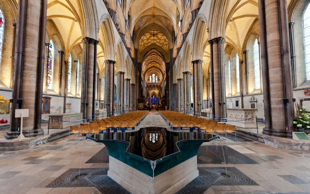 Salisbury Cathedral interior with vaulted ceilings and central nave.