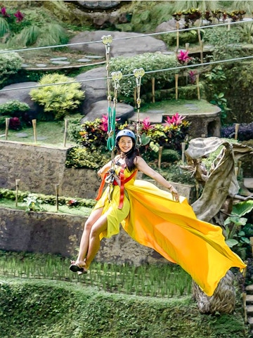 Ziplining over lush gardens at Alas Harum Bali.