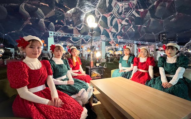 Women in festive attire at Tokyo Christmas Market 2024 in Jingu Gaien.