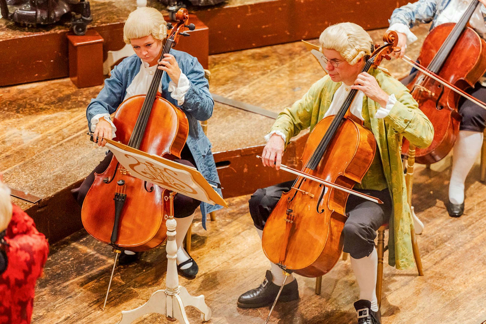 Cellists performing at the Musikverein Vienna during a Mozart concert.