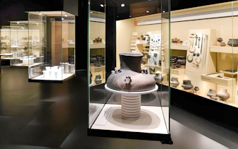 Ancient pottery display inside Bratislava Castle museum exhibit.