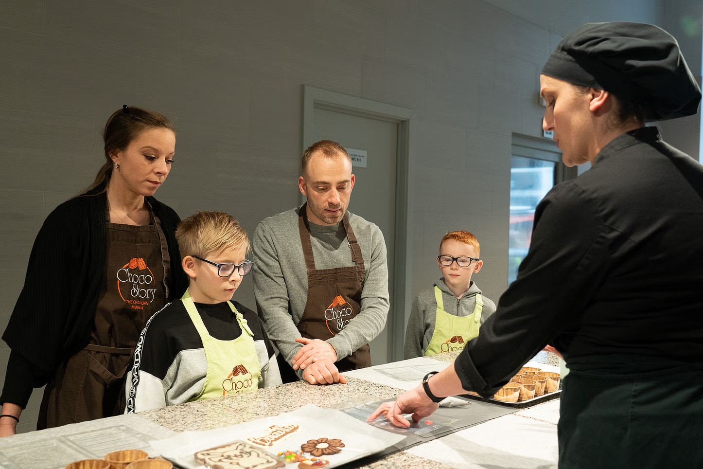 Guests participating in a chocolate-making workshop at Choco-Story Brussels Museum.