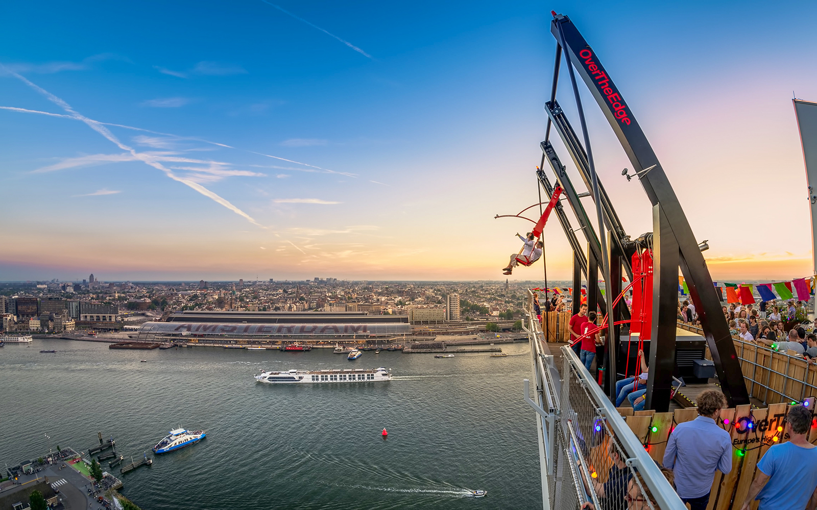 Wide-angle view from A’DAM Lookout of Amsterdam skyline and canals.