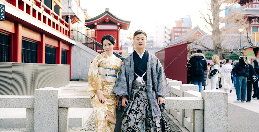 Couple in traditional attire posing at Kiyomizu Dera, Kyoto.