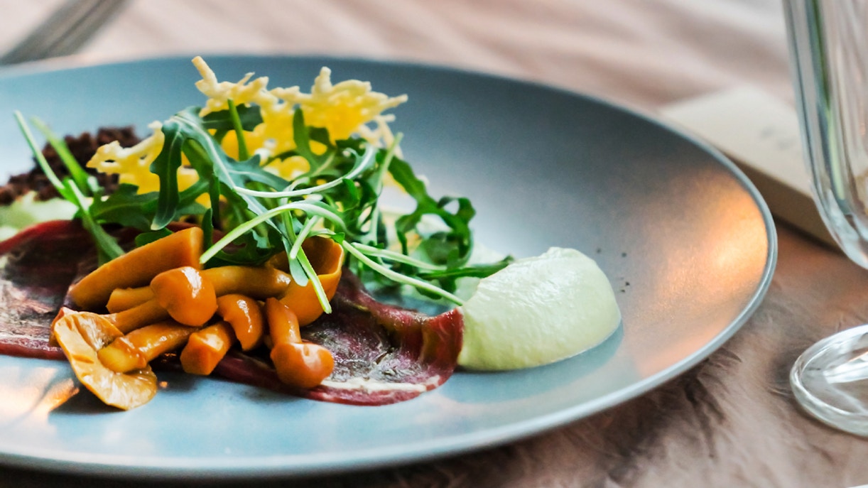 Traditional British dishes served on a table in a London restaurant for a pre-theatre supper.
