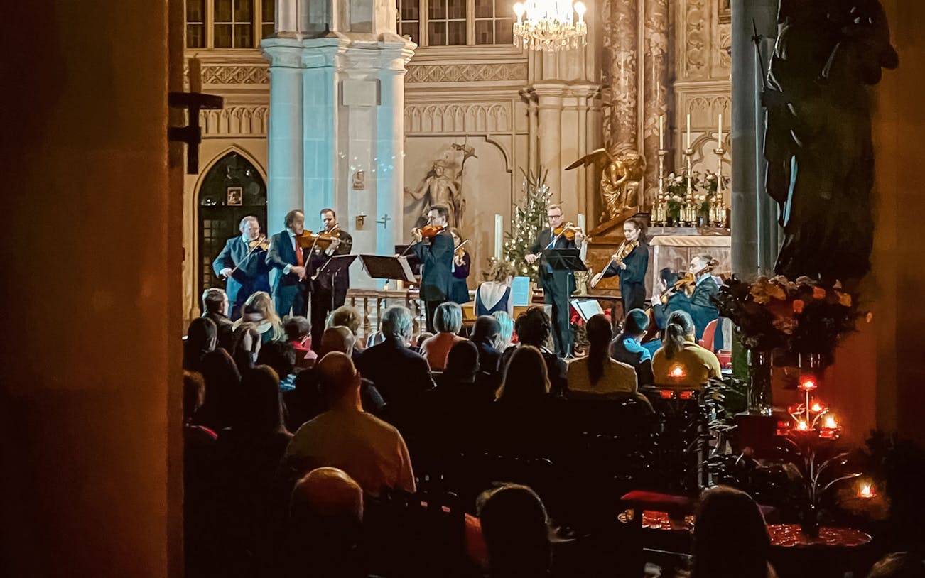 Musicians performing at a classical concert in Minoritenkirche, Vienna.