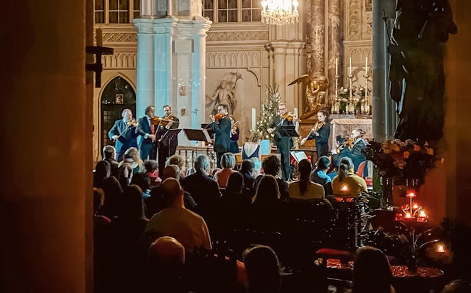 Musicians performing at a classical concert in Minoritenkirche, Vienna.