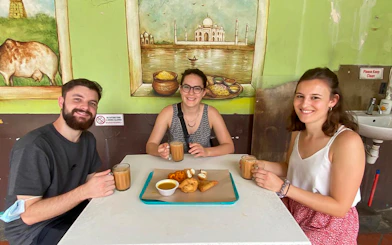 Visitors enjoying traditional snacks and tea on the Little India Hawker Food Tasting Tour.