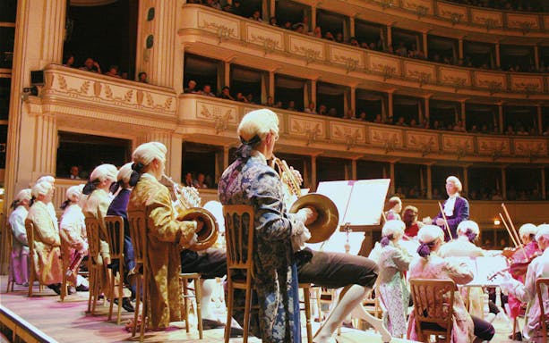 Orchestra performing Mozart concert at Vienna State Opera.