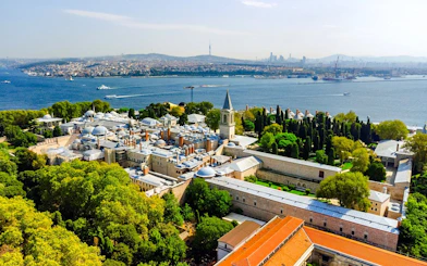 Aerial view of Topkapi Palace in Istanbul with Bosphorus Strait in the background.