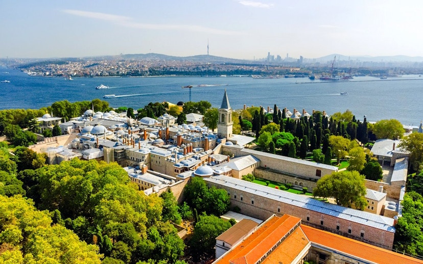 Aerial view of Topkapi Palace in Istanbul with Bosphorus Strait in the background.