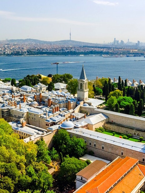 Aerial view of Topkapi Palace in Istanbul with Bosphorus Strait in the background.