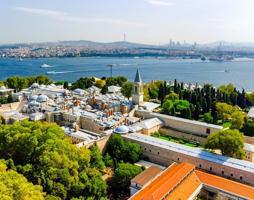 Aerial view of Topkapi Palace in Istanbul with Bosphorus Strait in the background.