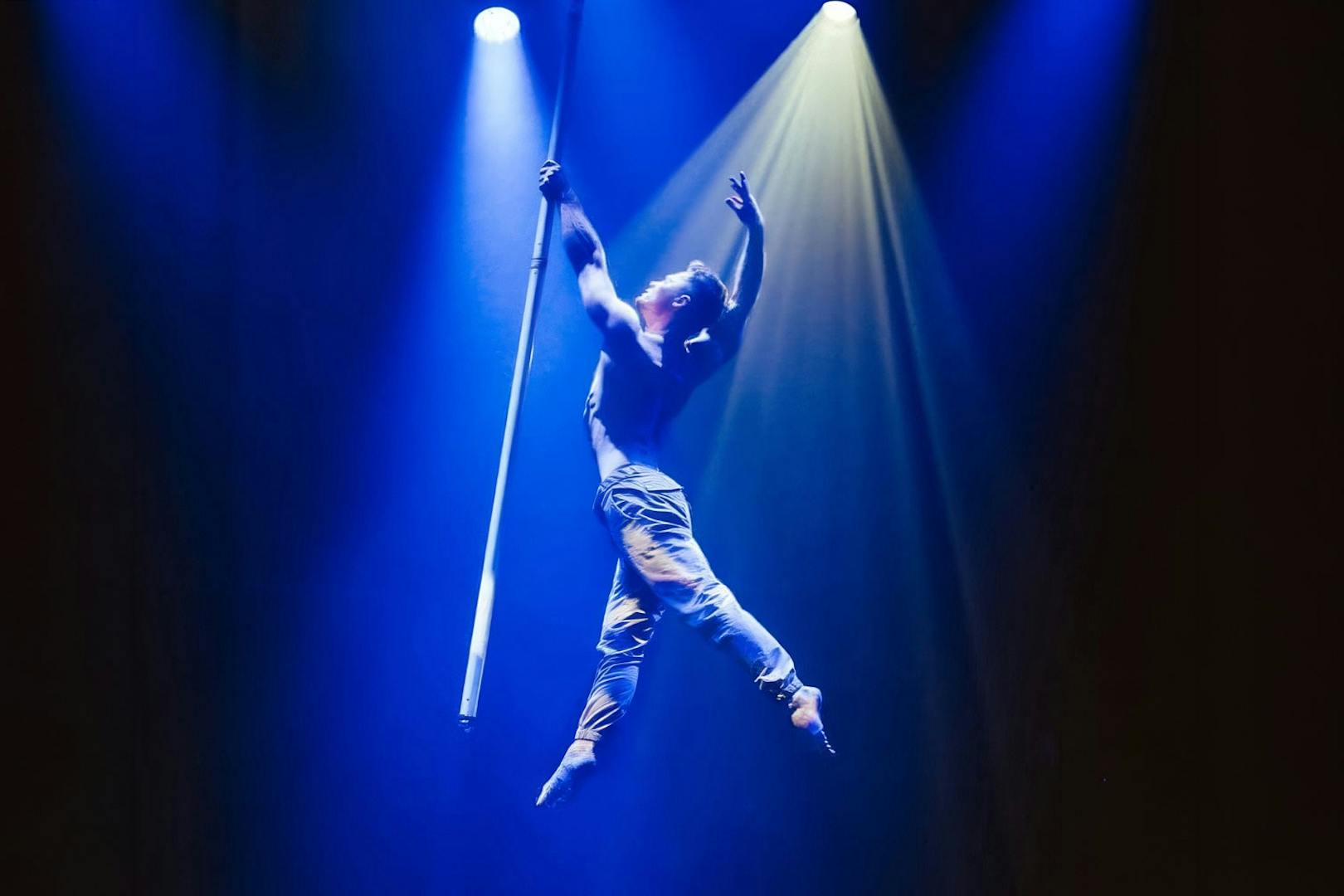 Aerial performer on pole during La Ronde show in Sydney.