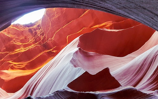 Antelope Canyon's swirling red rock formations viewed from an airplane tour.