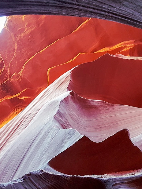 Antelope Canyon's swirling red rock formations viewed from an airplane tour.