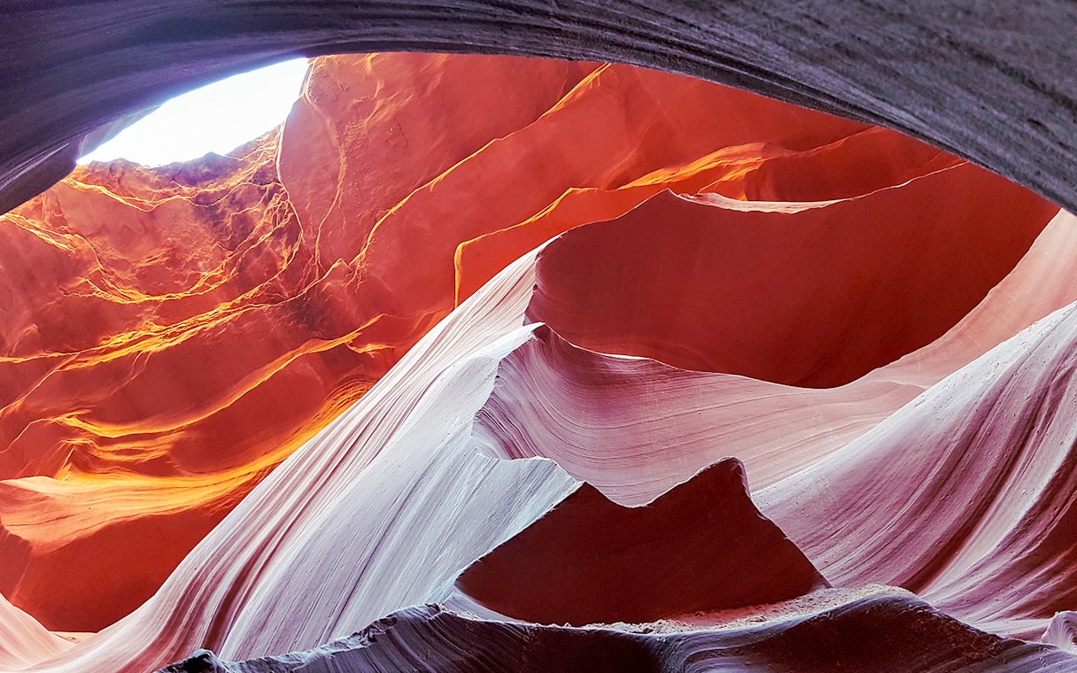 Antelope Canyon's swirling red rock formations viewed from an airplane tour.