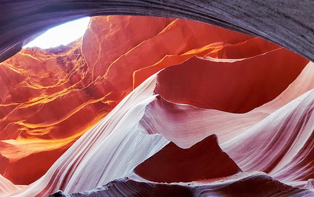 Antelope Canyon's swirling red rock formations viewed from an airplane tour.