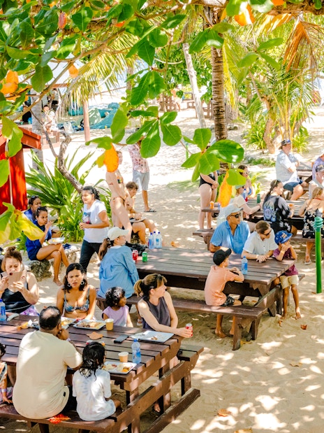 Meke dancers performing for guests during lunchtime on South Sea Island, Fiji.