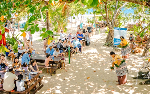 Meke dancers performing for guests during lunchtime on South Sea Island, Fiji.