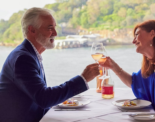 Couple enjoying lunch on a cruise of Sydney harbour