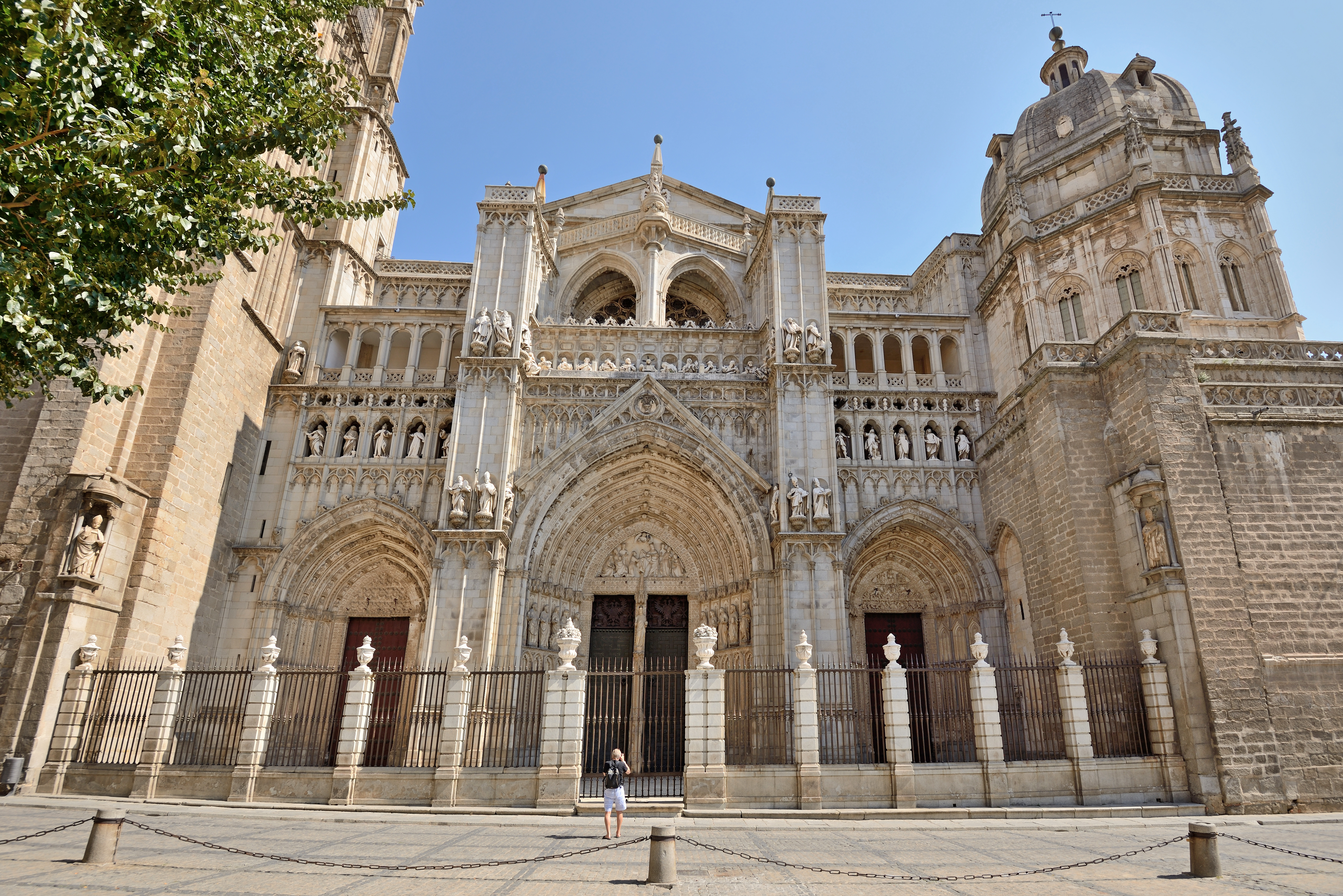 Facade of the Church of Santo Tomé in Toledo, Spain, featuring detailed stone carvings.