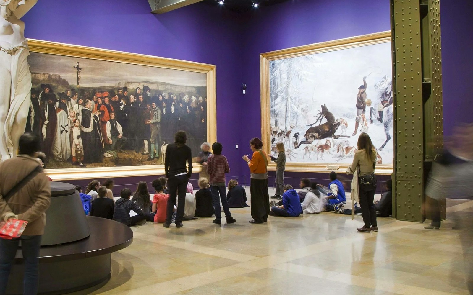Group of people studying the paintings at Orsay Museum, Paris